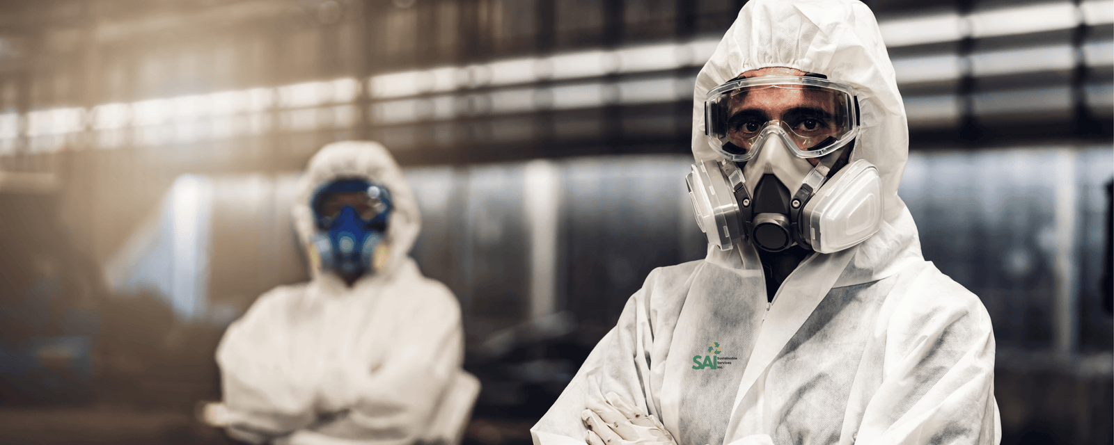 SAI remediation crew in full protective suits and respirators on a controlled worksite